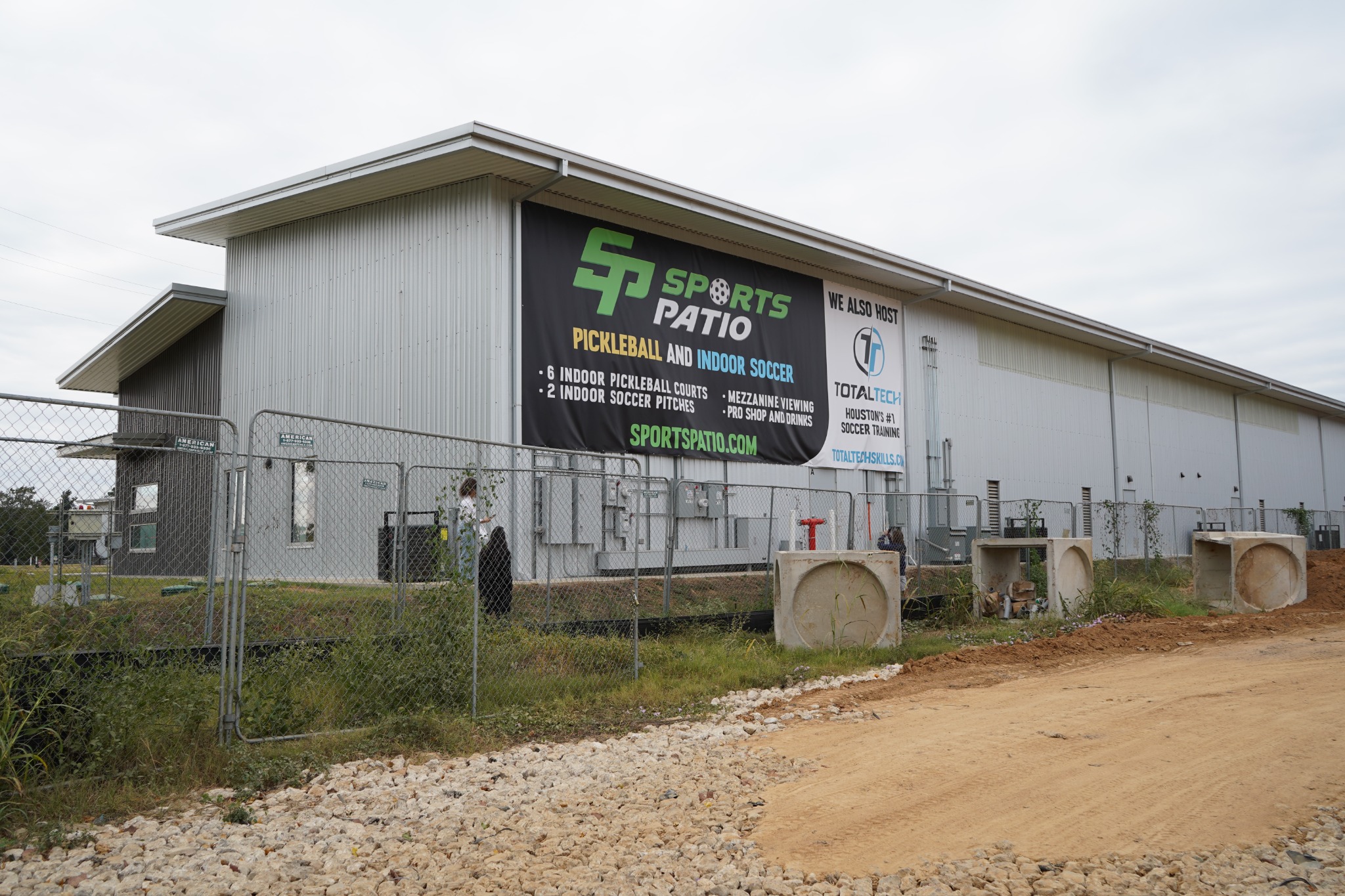 Large SportsPatio and TotalTech exterior banners installed on the sports facility